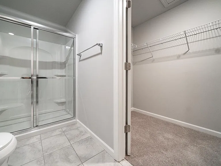 Walk-in closet is a spacious 5'X 9'