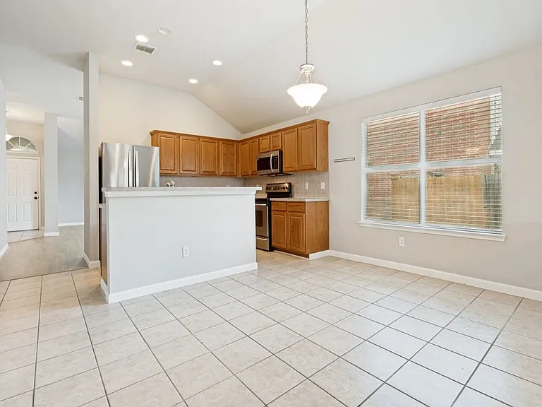 Open plan kitchen with cabinetry, and stainless steel appliances