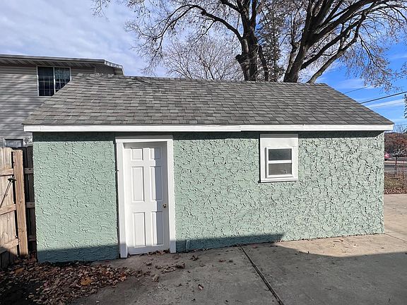 Large concrete area between house and garage. Great place to park a small car or add patio set and start relaxing.
