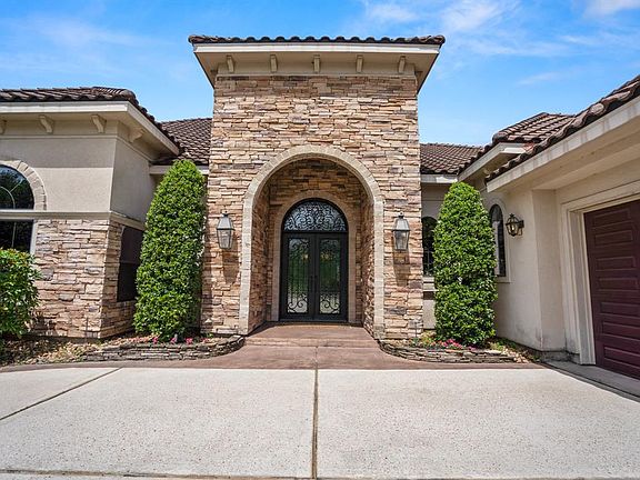 Be prepared to be wowed with this gorgeous home, the front features a stacked stone elevation with gas lanterns and impressive double beveled glass & wrought iron doors.
