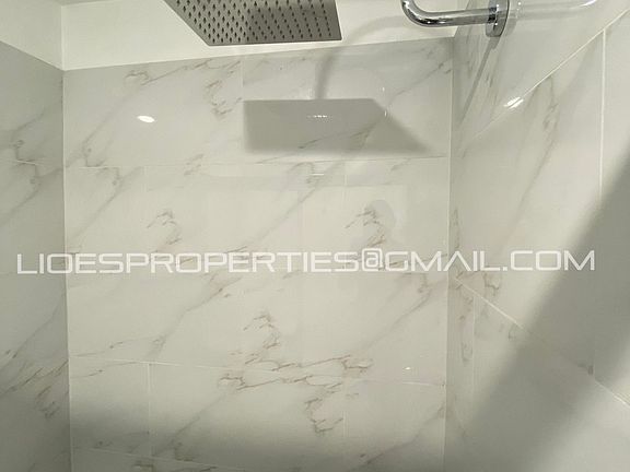 New rain shower head and glass sliding doors