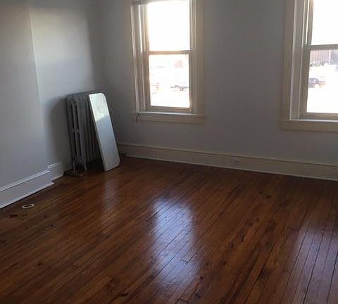 Part of the living room. The room is twice this size with 2 nice closets