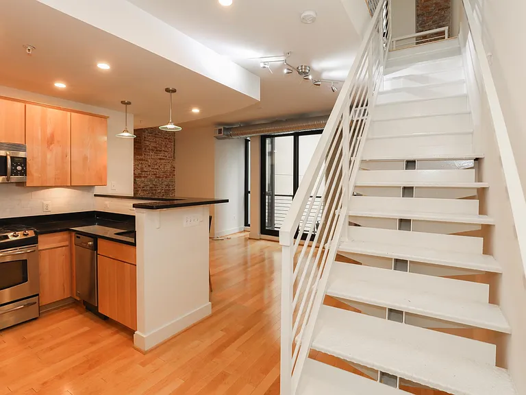 Kitchen and stairs to second floor.