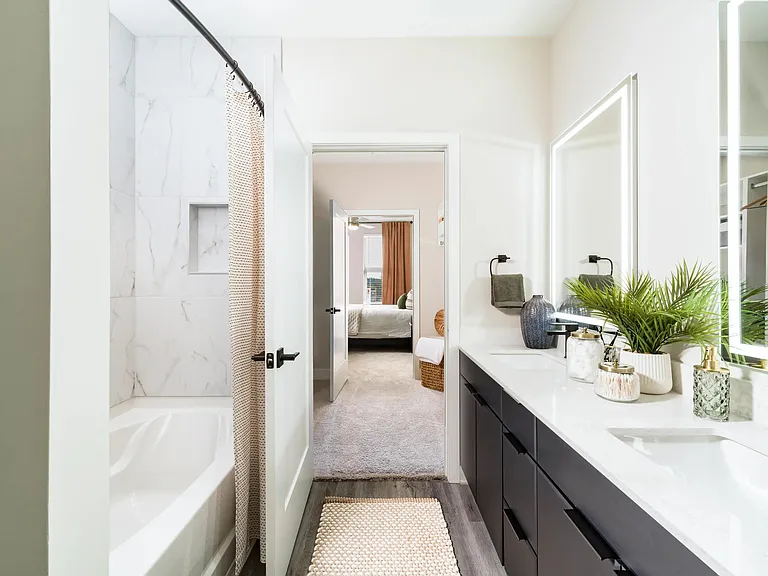 A premium primary bath with a double vanity, clean-lined finishes, and a walk-in shower designed for everyday routines and easy mornings.