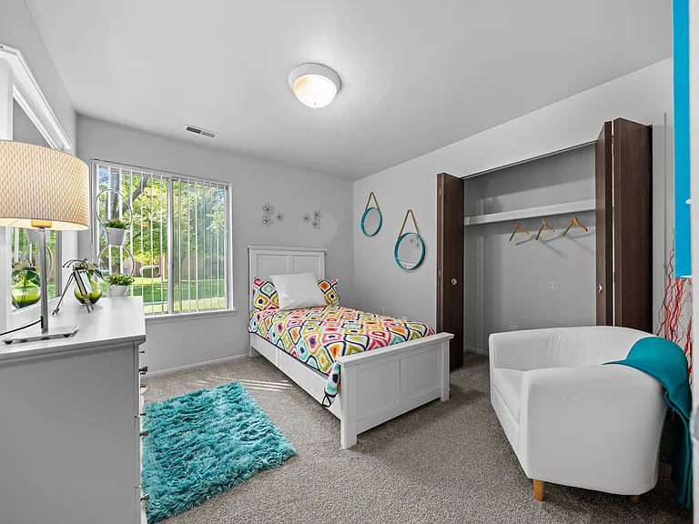 Bedroom with natural lighting at Westwood Village Apartments in Westland, MI