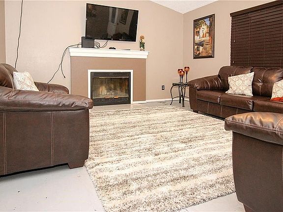 Spacious living room with wood burning fireplace!