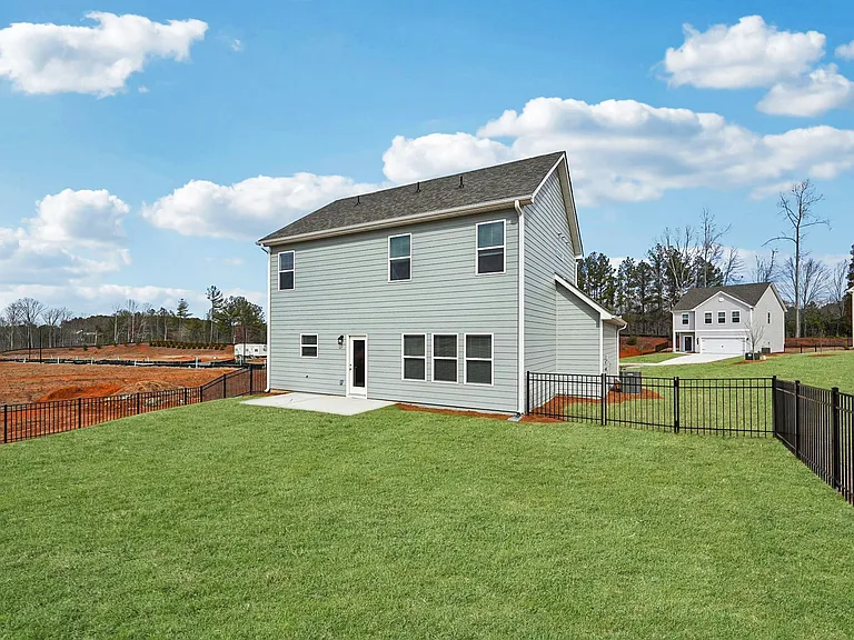 The back exterior of the Alexander floor plan's patio and fenced-in yard.