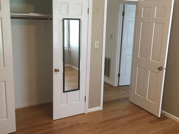 2nd bedroom looking NE towards bedroom hallway. This flooring was installed Aug 23 2020. Just past the 2nd bedroom entry doorway is the entry doorway to the 3rd bedroom.