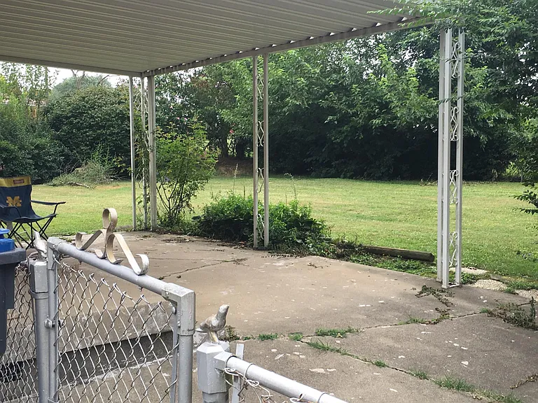 Fenced in large backyard and covered patio