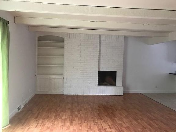 Fire place and built in bookshelf in living room