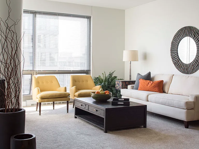 Floor-to-ceiling windows invite natural light into our designed living spaces, perfect for relaxation and entertaining.