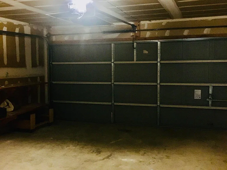 Clean garage with the working station.