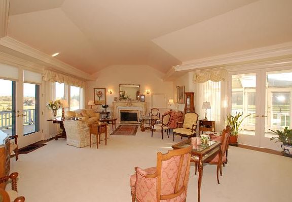 The Formal Living Area, Vaulted Ceilings with Recessed Lighting, Fireplace with Custom Designed Mant
