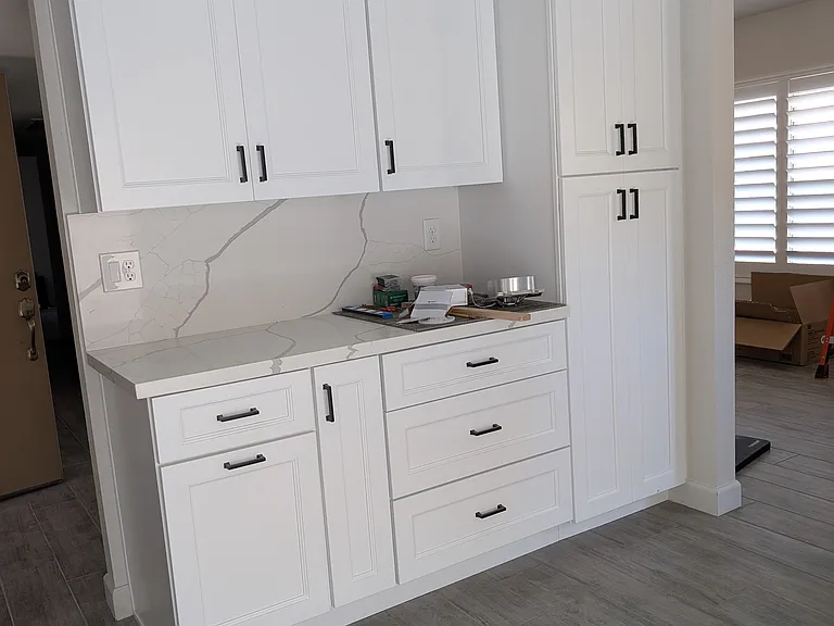 New kitchen cabinets, countertops, pull-out garbage, large pantry, lots of storage.