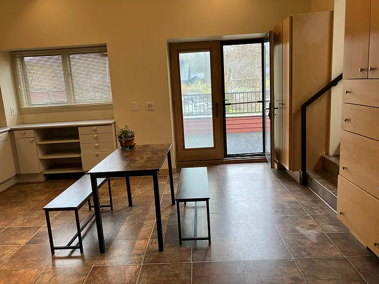 Kitchen with outside entrance to upper deck on river