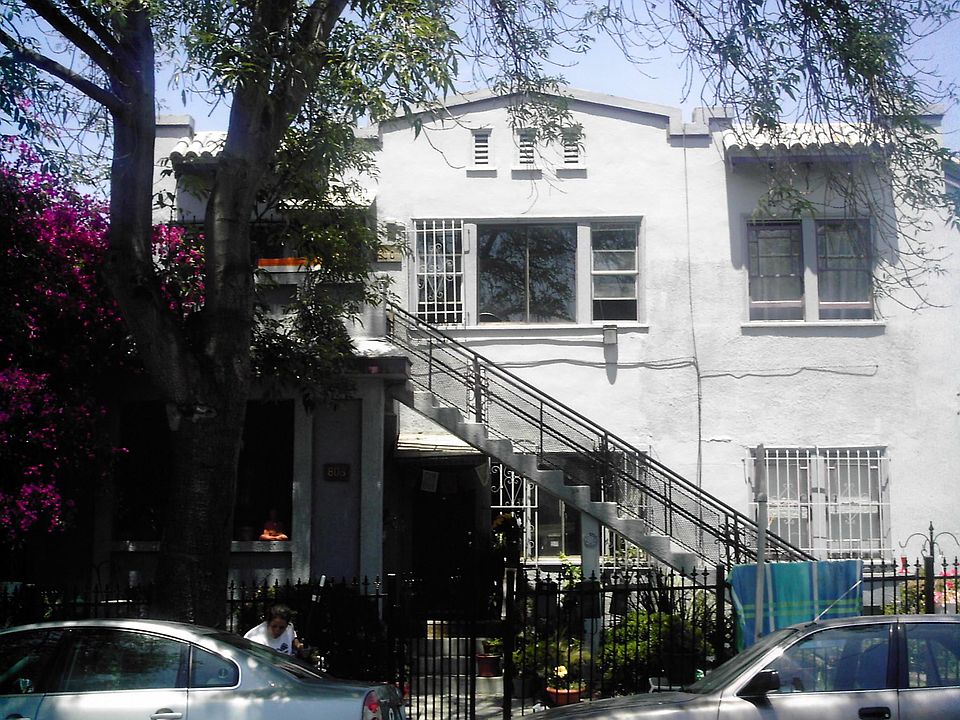 61st Street entrance (upper unit). There is also a rear entrance from the parking lot.