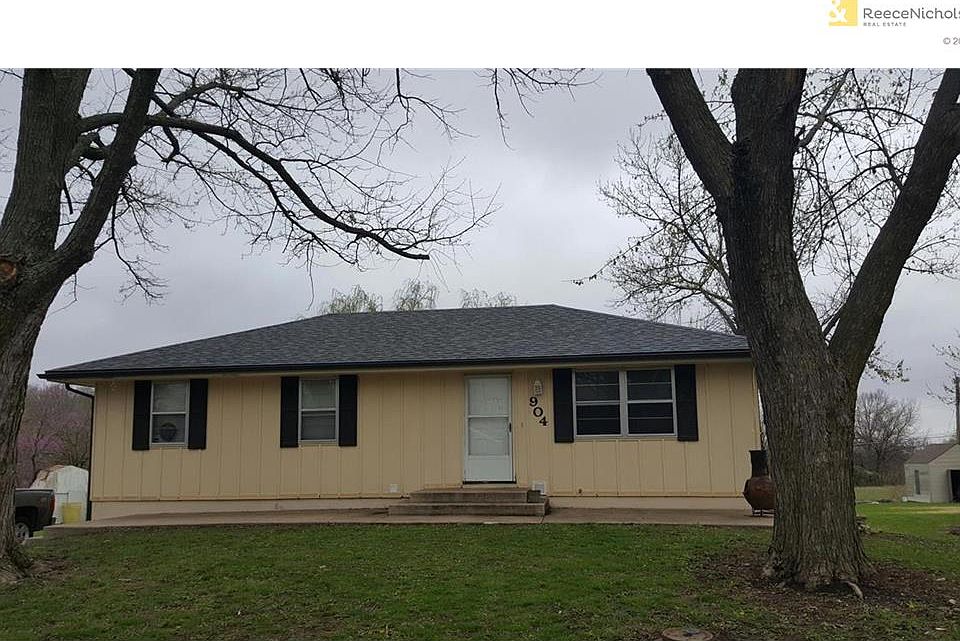 Large fenced lot with 2 garages