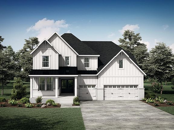 brick, board and batten house with front porch