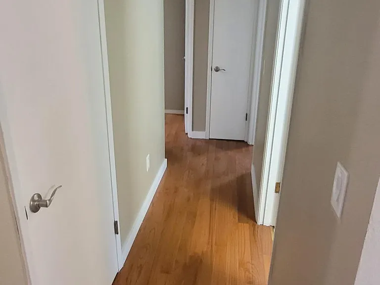 Oak floors in hallway and all three bedrooms