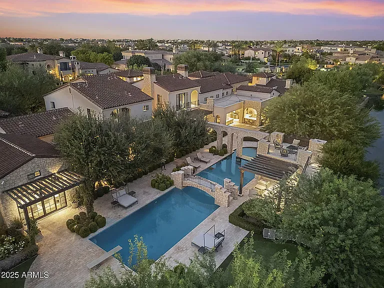 Private resort-style retreat featuring expansive pools, outdoor living spaces, and serene neighborhood views. - 621 W Sunshine Pl