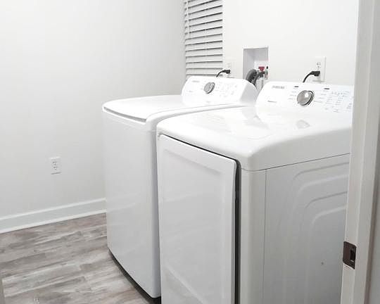 Brand new High Efficiency GE electric washer and gas dryer in a large walk-in laundry room allow for convenience and low cost ongoing utilities!