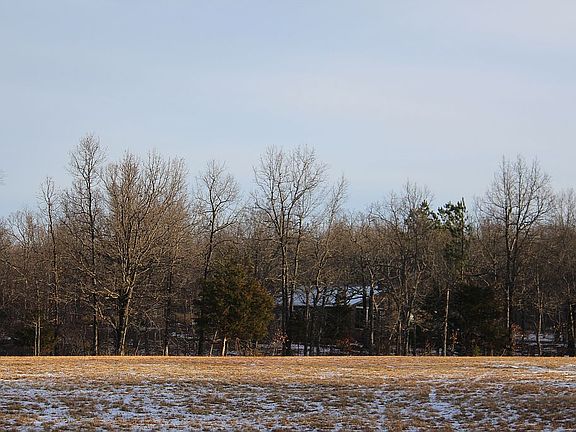 view of home from hayfield