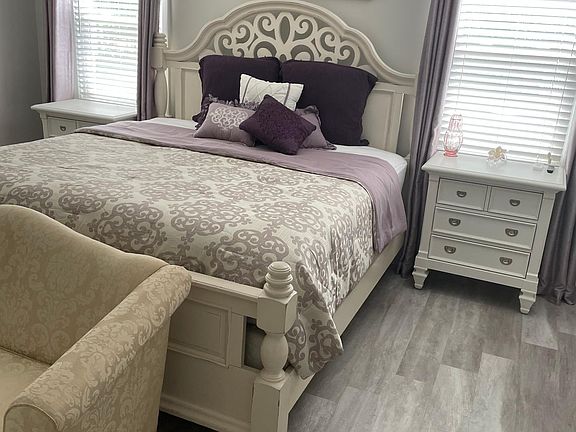 Master bedroom. The furniture and glitter picture are for sale as the home will be rented empty unless renter wants to purchase furniture separately.