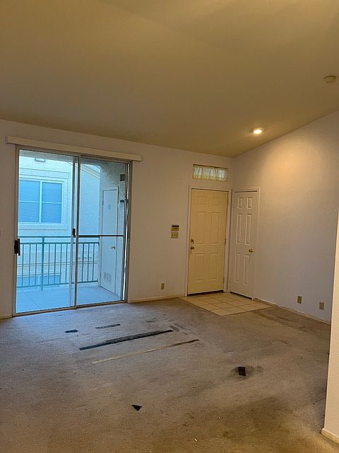 Main entrance. Flooring will be replaced with Luxury vinyl flooring. The unit is still undergoing renovations. The walls are frehly painted. A new vertical blinds will be installed prior to moving in.