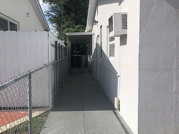 Left side facing the house