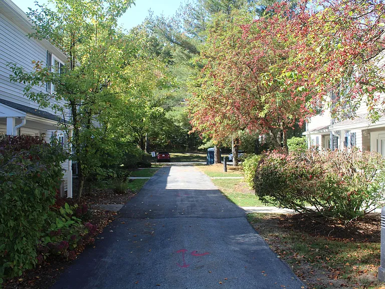 Lighted walkway to front of townhouse. Plenty of off street parking.