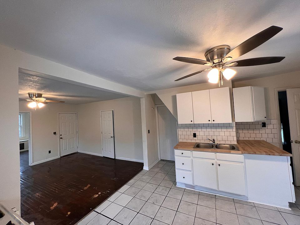 The kitchen and living room have been conjoined to an open concept between the two by removing the wall that used to separate the two