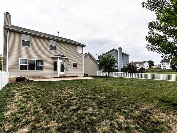 Newly fenced, level back yard.  Enjoy the stamped patio.