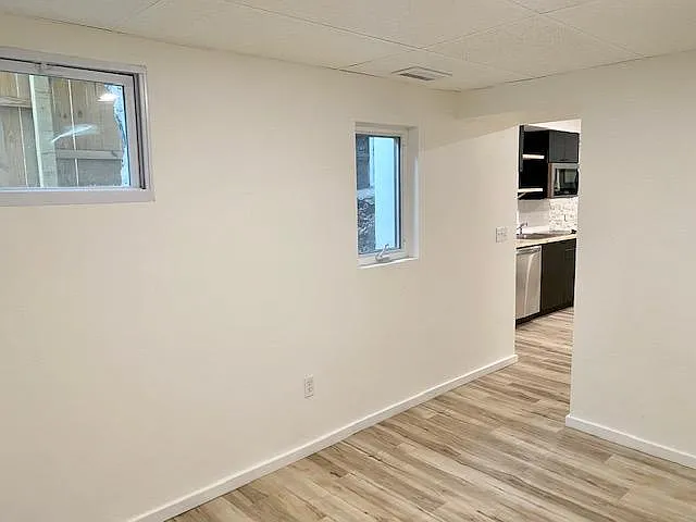 Bedroom looking to kitchen/living.