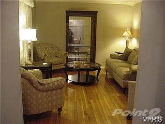 Inviting Living Room has beautiful hardwood flooring you will ap