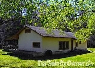 Creek running 1,000 feet along the hill
						:
						Taken in the fall, The house, yard and well-house on the higher area at left.