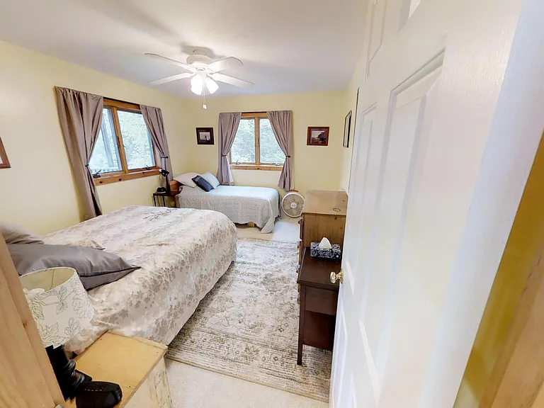 Second level bedroom 3 with queen and twin size beds.