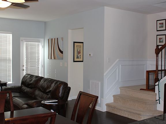 Back of the livingroom showing the Livingroom and door to th