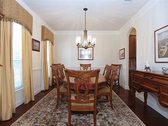 To the other side of the entry, is the formal dining, with a butlers pantry for convenient entertaining.