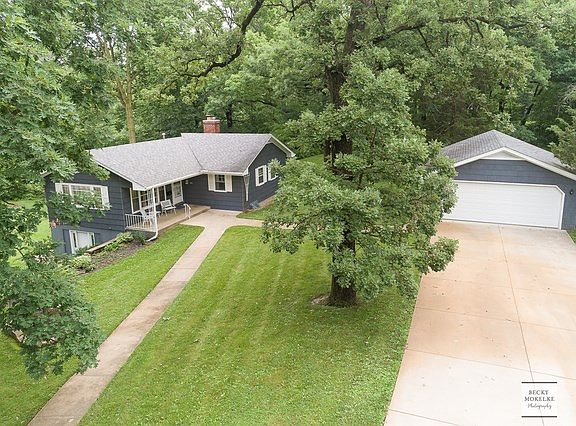 Gorgeous 1.68 acre property surrounded by many beautiful trees~You'll love the large 2+ car garage w