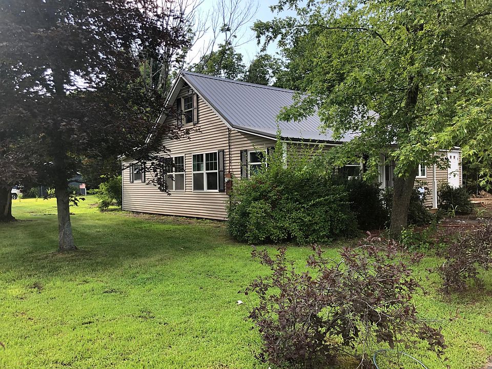 This fully renovated 1,700sf home is surrounded by mature trees and flowering plants