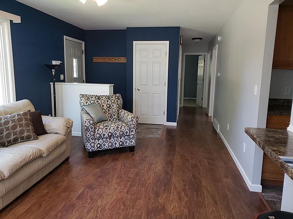 Livingroom looking down hallway to bedrooms and bathroom