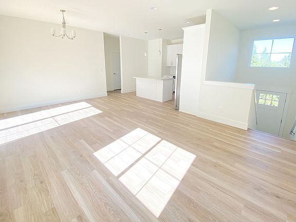 looking back from living room to kitchen and dining area