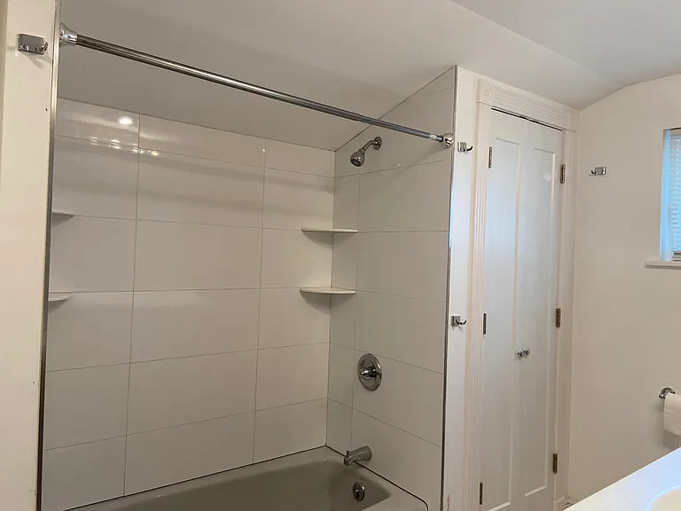 Bathroom shower and linen closet