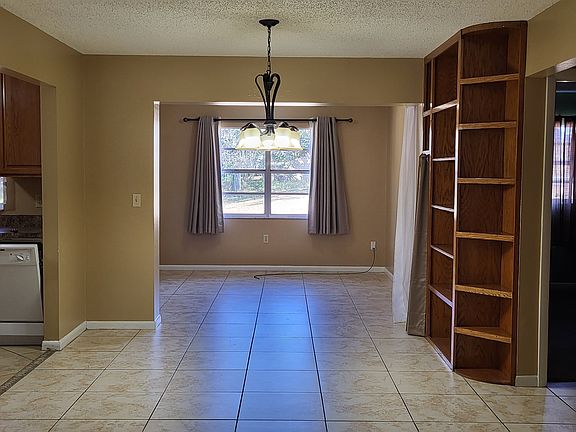 Dining room with bonus room behind it