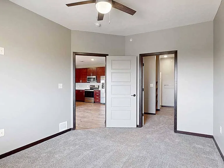 Unwind in the comfortable primary bedroom, complete with an ensuite walk-in closet and bathroom.