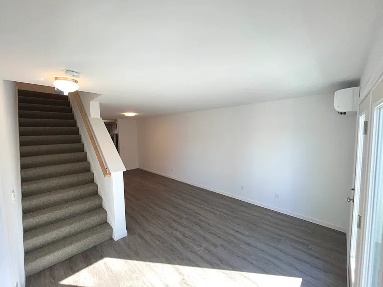 Living room with stairs to bedrooms