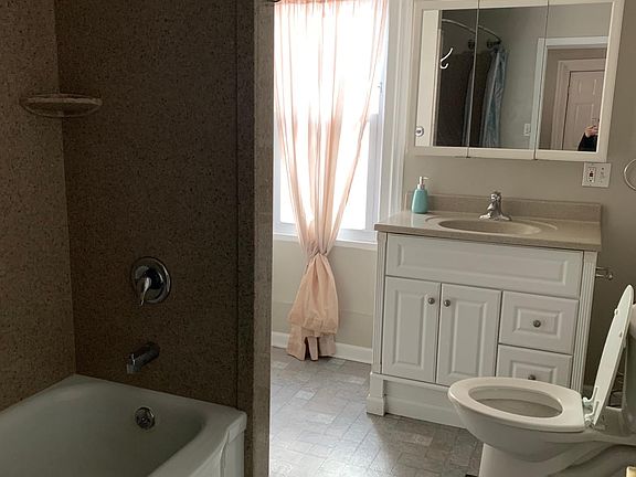 Bathroom with walk in closet.