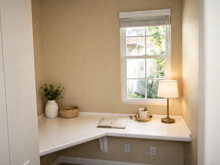 Built in workspace nook with natural light, ideal for home office or study area