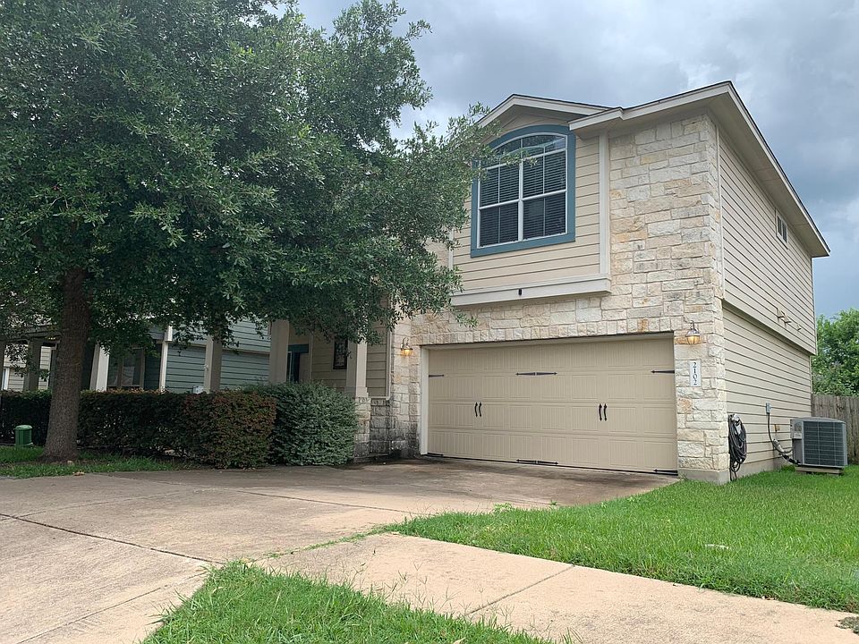 2-car attached garage with ample parking in driveway and guest parking across the street.