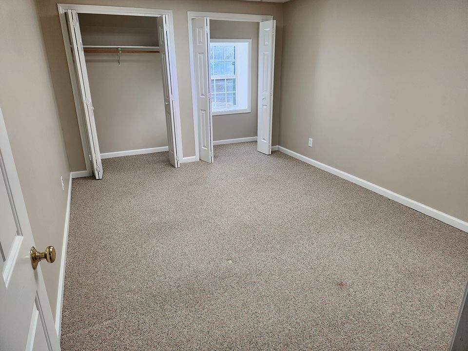Bedroom, closet, window overlooking tenant parking